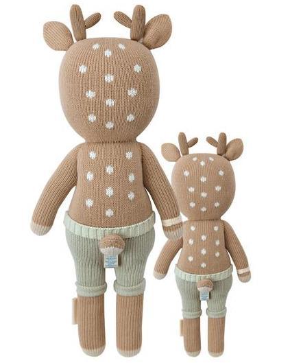 Two plush deer toys named Elliott the Fawn with polka-dot patterns and wearing pants, designed for children to explore from cuddle + kind.