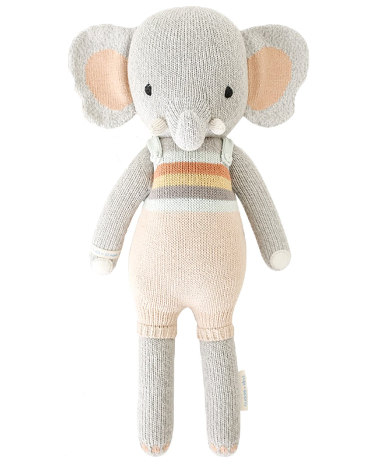 Handmade evan the elephant with striped outfit on a white background by cuddle + kind.