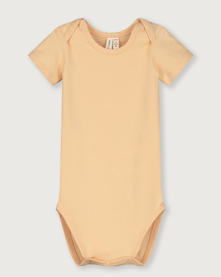 Little gray label baby girl baby onesie in apricot