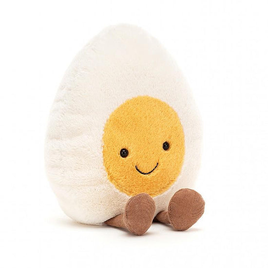 An Jellycat Amuseable Boiled Egg shaped stuffed animal sitting on a white background.