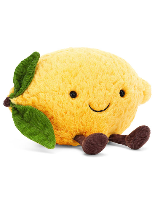 A yellow Jellycat Amuseables Lemon stuffed animal with a smile on its face.