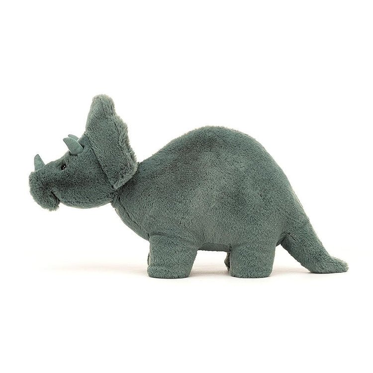 A Jellycat Fossilly Triceratops with soft fur is standing on a white background.