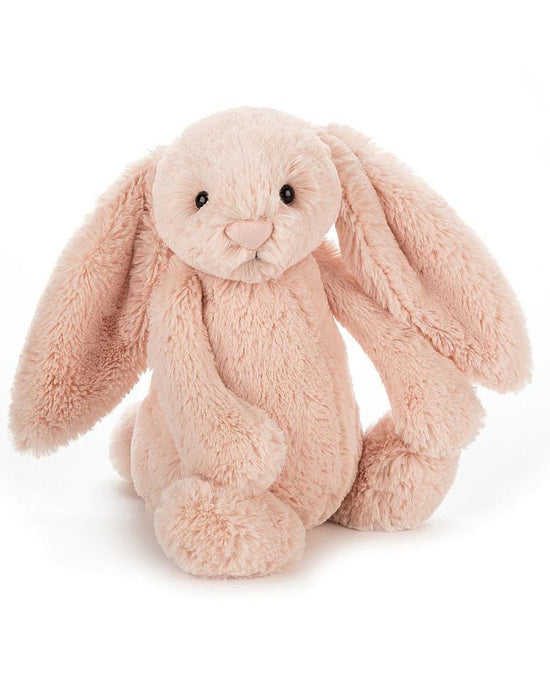 A medium blush jellycat bashful bunny stuffed animal sitting on a white background.