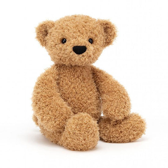A soft furry Jellycat Medium Theodore Bear sitting on a white background.