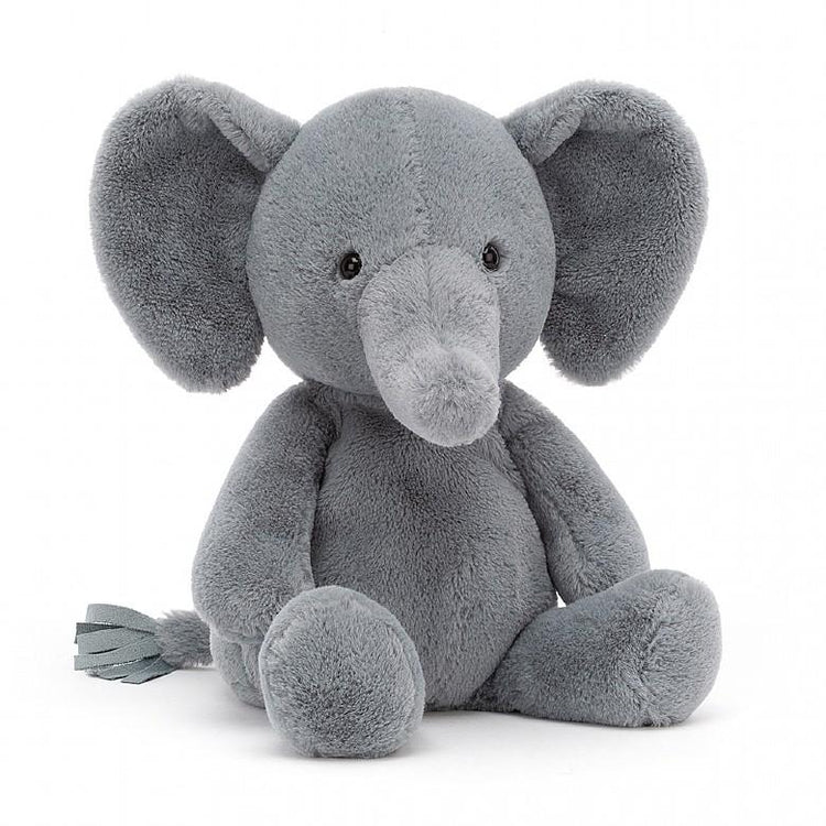 A huggable gray Jellycat nimbus elephant stuffed animal sitting on a white background.