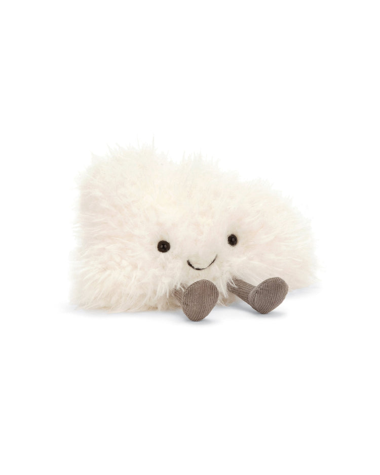 A Jellycat small amuseables cloud stuffed animal lying on a white surface.