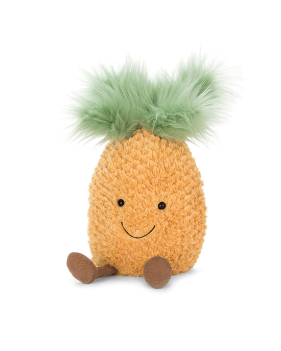 A small amuseables pineapple by Jellycat with tropical giggles and a green pom-pom.