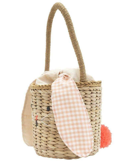 Meri Meri bunny woven straw bag with a fabric liner and a decorative pom-pom and gingham flip-flop attached.