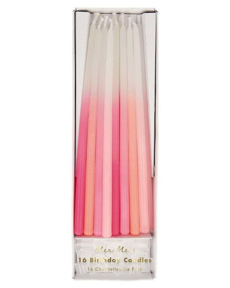 Box of 16 Meri Meri dipped tapered candles in pink, in a gradient from white to pink.