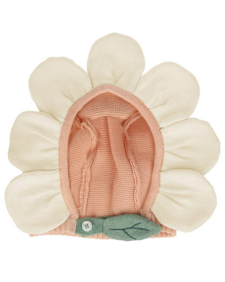 A peach daisy baby bonnet with a flower-shaped design, featuring petal detail by Meri Meri.