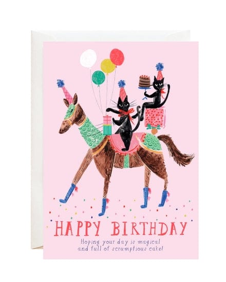 A delightful card featuring a unicorn eating cake, perfect for birthdays. The text reads: "HAPPY BIRTHDAY. Hoping your day is magical and full of scrumptious cake!" Pair it perfectly with our charming gift wraps from Mr. Boddington's Studio.