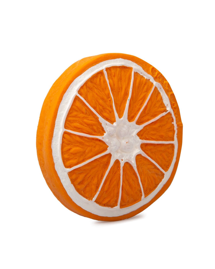 A cross-section of a clementino the orange against a white background, symbolizing a healthy lifestyle by oli + carol.
