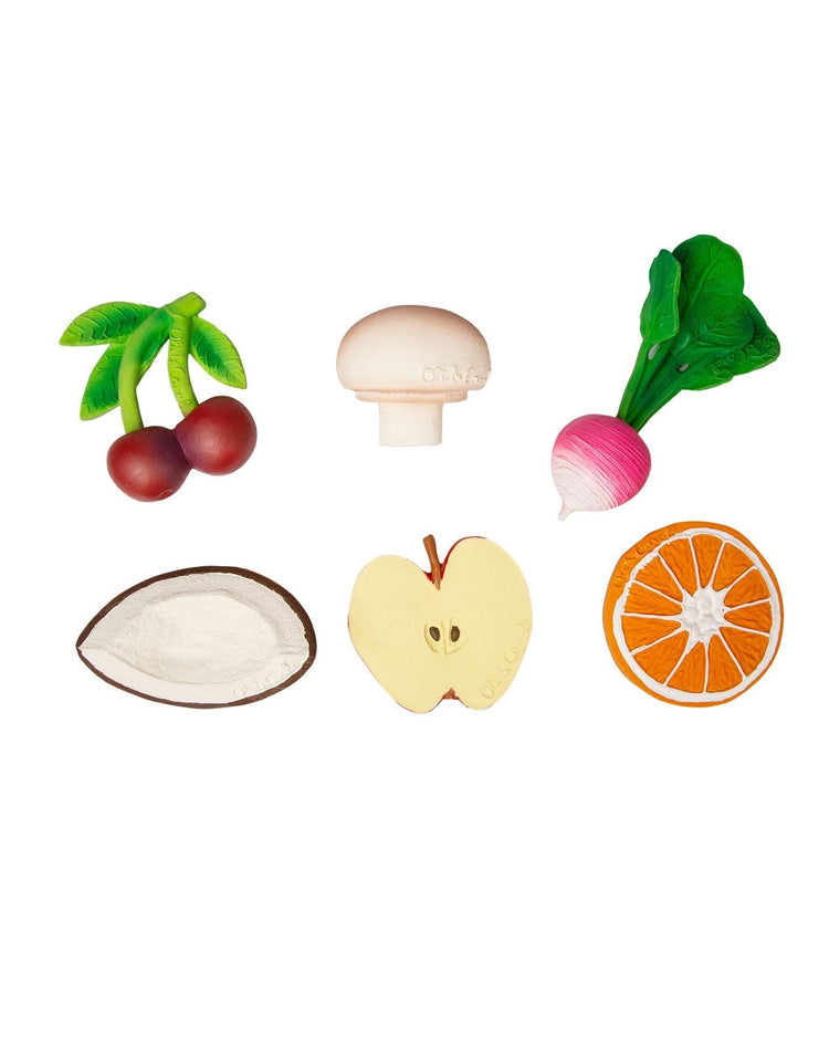 Various manolo the mushroom plastic and natural rubber toy fruits and vegetables from oli + carol, suitable for teething babies, isolated on a white background.