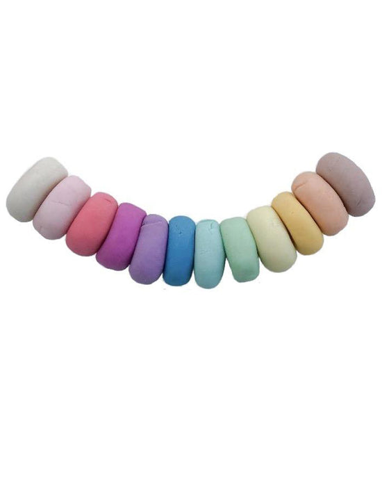 A row of colorful macarons, made with non-toxic ingredients, arranged by gradient on a light background made with Vanilla Dough from The Dough Parlour.